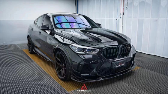 สําหรับ BMW X6M F96 คาร์บอนไฟเบอร์ คอร์ดี้คิต X6M F96 อัพเกรด AE Style คาร์บอนไฟเบอร์หน้าลิปดีฟิวเซอร์ สปอยเลอร์